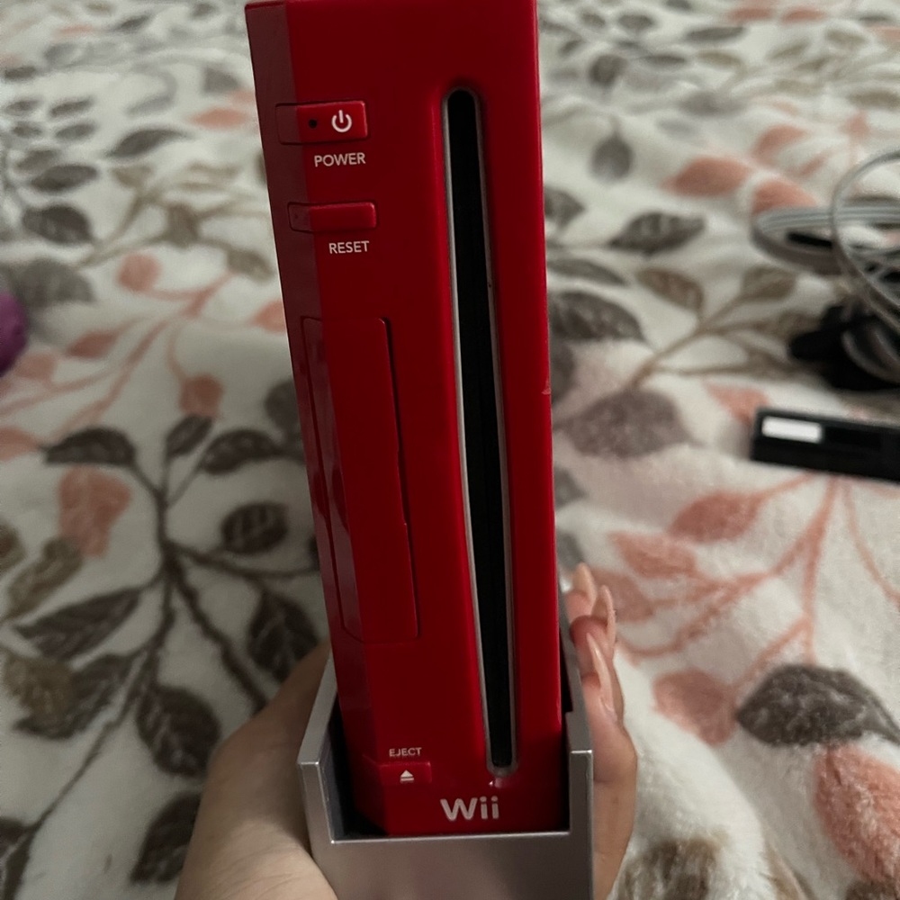 Red wii counsel (used) has HDMI cord attachment so you can play on todays tv.